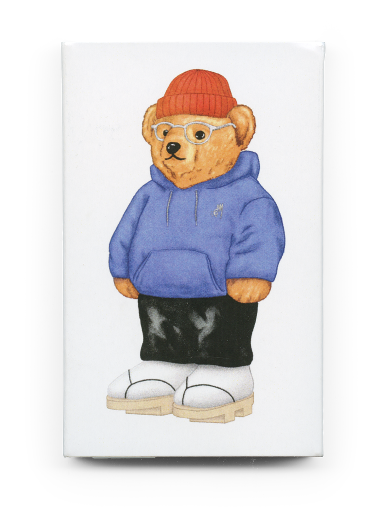 Front of (818) JA-NET cassette tape O-card showing polo bear in blue hoodie and orange beanie