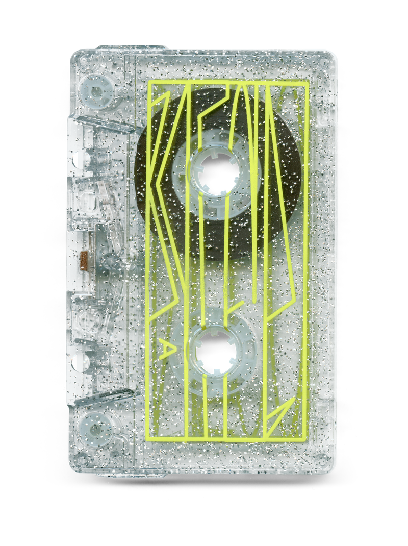 Front of transparent Talmbout cassette tape shell with gray glitter